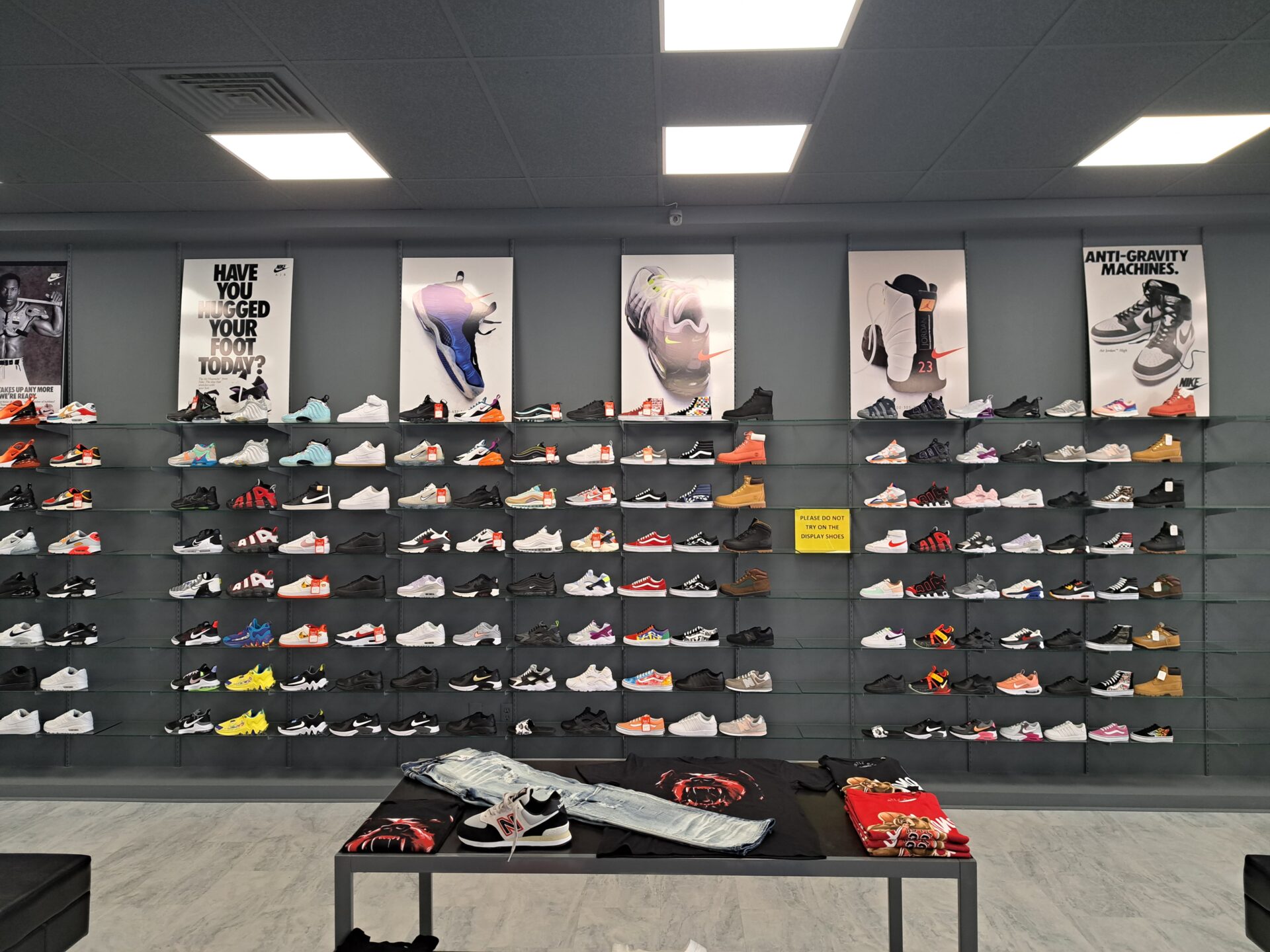 Sneakers 6 shoes on rack showcase in the show room
